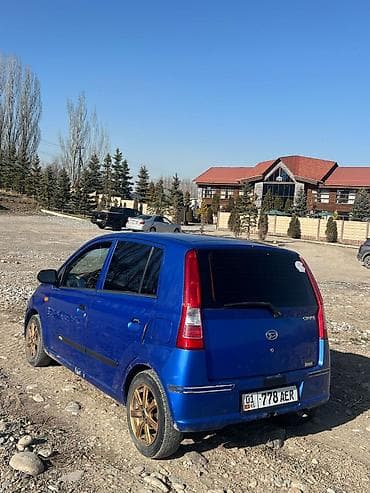 golf 2: Daihatsu Cuore: 2003 г., Автомат, Бензин, Хэтчбэк — 7