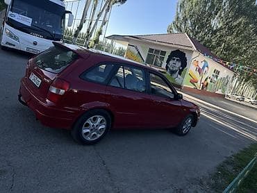 ваз 2112: Mazda 323: 1998 г., 1.5 л, Механика, Бензин, Хэтчбэк — 7