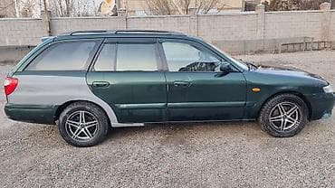 Транспорт: Mazda Capella: 2000 г., 2 л, Механика, Бензин, Универсал — 4