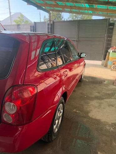 aion s plus: Mazda 323: 2002 г., 1.6 л, Механика, Бензин, Хэтчбэк — 9