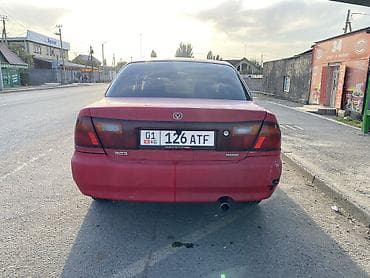 1994: Mazda 323: 1994 г., 1.6 л, Автомат, Бензин, Седан — 4