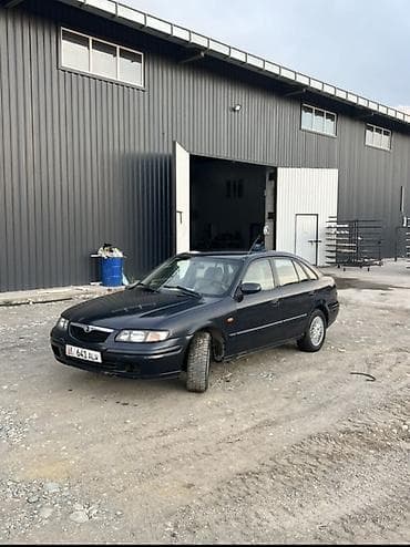 салон машины: Mazda 626: 1997 г., 2 л, Механика — 2