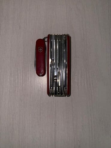 Музыкальные инструменты: Мультитулы и швейцарские ножи (набор) 1) Красный швейцарский нож — 5