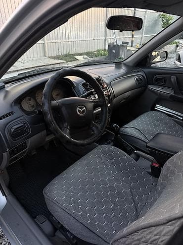 pes 2013: Mazda 323: 2003 г., 1.6 л, Механика, Бензин, Седан — 1