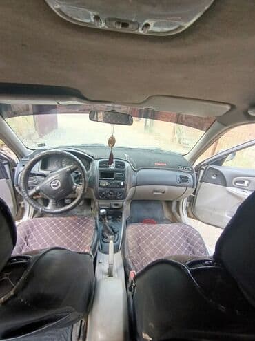 опел зафира б: Mazda 323: 2001 г., 1.6 л, Механика, Бензин, Хэтчбэк — 8