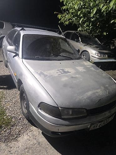 задняя крыло: Mazda 626: 1993 г., Механика, Бензин, Седан — 4