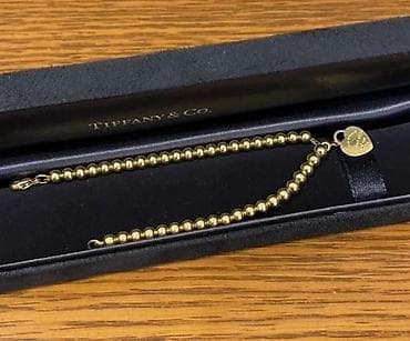 Браслет Tiffany & Co. Beads с подвеской-сердцем золото 585 пробы