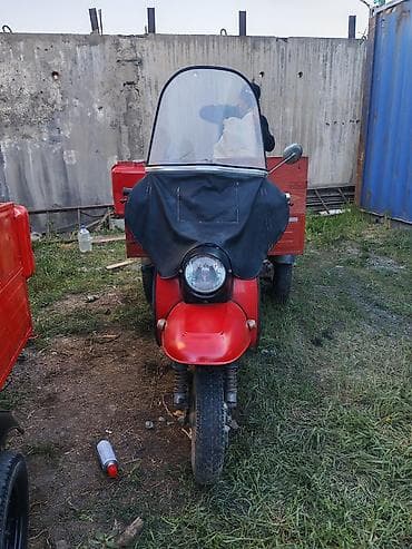 трёх калёсный скутер: Грузовой мотороллер-трицикл с кузовом Описание: - Компоновка — 7