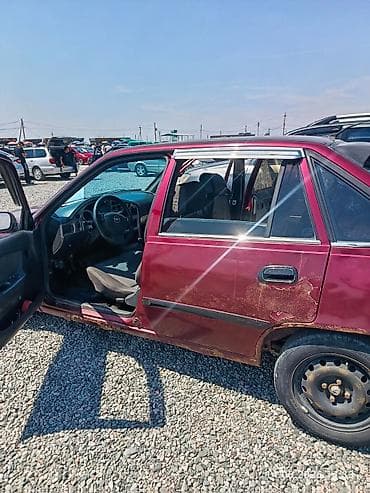 левый: Daewoo Nexia: 2011 г., 1.5 л, Механика, Бензин, Седан — 4
