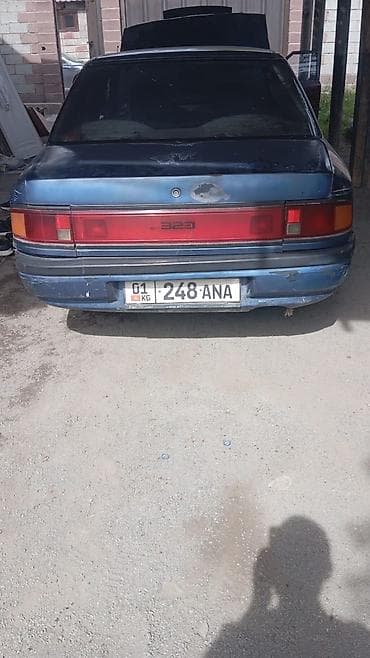 mitsubishi pojero: Mazda 323: 1994 г., Механика, Бензин — 10