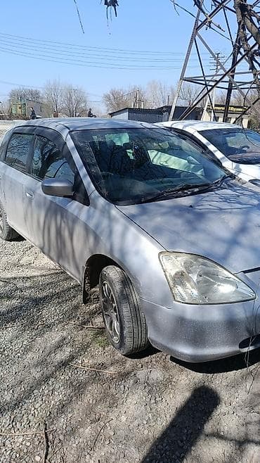 Продаётся компактный 5‑дверный хэтчбек/универсал серого цвета