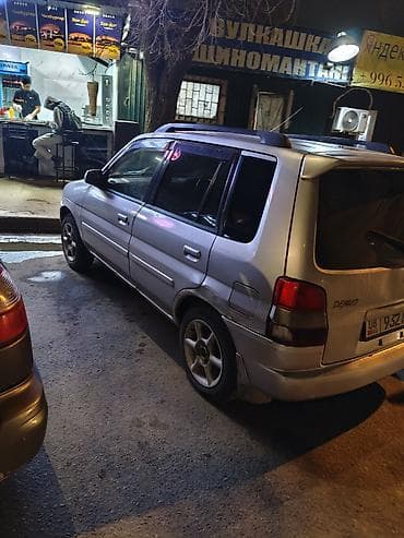 Mazda Demio: 1999 г., 1.4 л, Робот, Бензин, Универсал