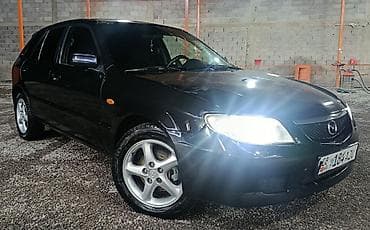 mini ev: Mazda Familia: 2001 г., 2 л, Ручные, Бензин, Хэтчбэк — 1