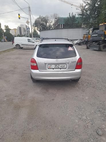 e 303: Mazda 323: 1999 г., 1.5 л, Автомат, Бензин, Универсал — 2