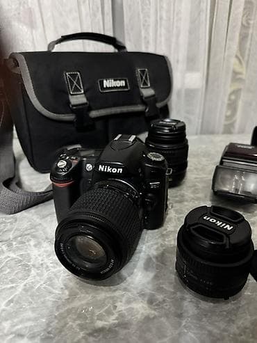 Видеокамеры: Зеркальный фотоаппарат Nikon с комплектом оптики и аксессуаров — 7