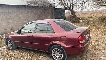 Mazda Familia: 1998 г., Бензин, Седан