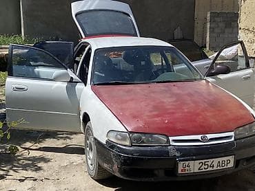 Транспорт: Mazda 626: 1992 г., 2 л, Механика, Бензин, Лифтбек — 7