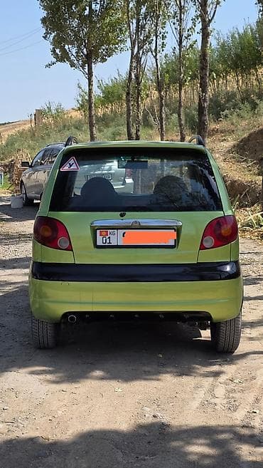 Microcar: Компактный городской хэтчбек зеленого цвета. Основные характеристики — 1