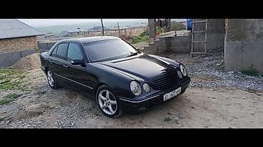 б у мешки: Mercedes-Benz E‑Class (W210), седан, темно‑синий/черный цвет кузова — 4