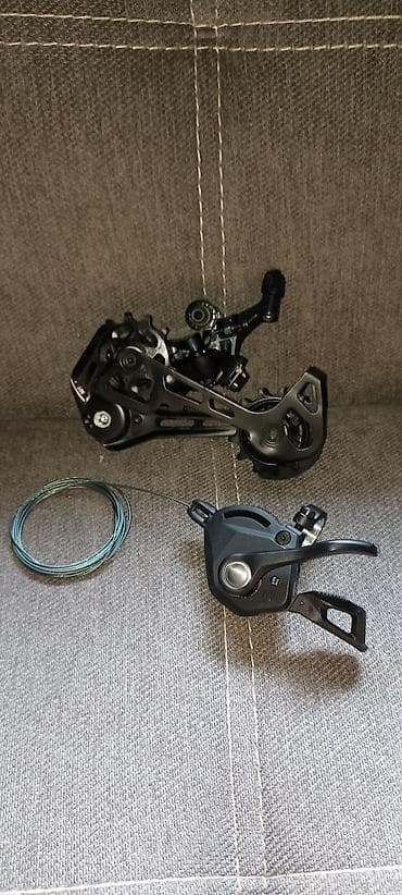 Задний переключатель и манетка Shimano CUES 11-скоростей Подходит для — 5
