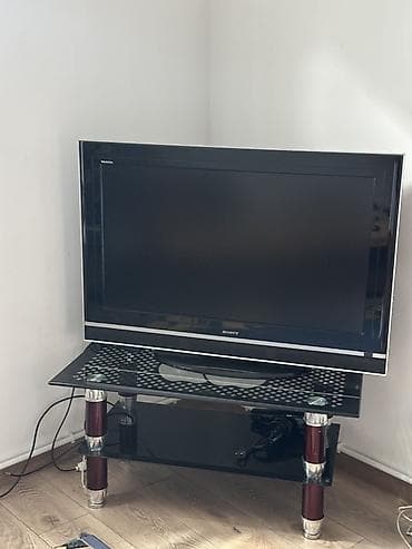 psp system: Телевизор Sony Bravia с плоским экраном на стеклянной тумбе. Основные — 2