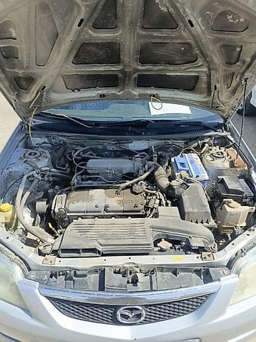 выбор номера о: Mazda 323: 2002 г., Механика, Бензин, Универсал — 6