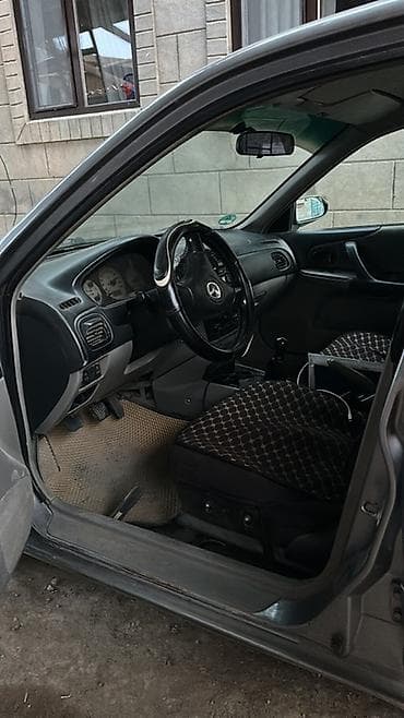 мини машины для взрослых: Mazda Familia: 2002 г., Механика, Бензин, Седан — 6
