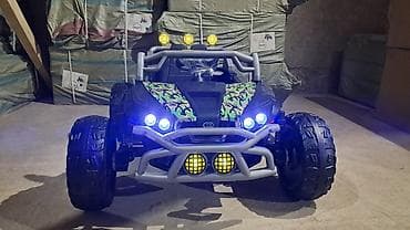 улуттук кийим: Балдар электрокары — 1