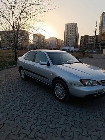 bmw e34 1995: Седан серебристого цвета, 4 двери, передний привод. Кузов с плавными — 1