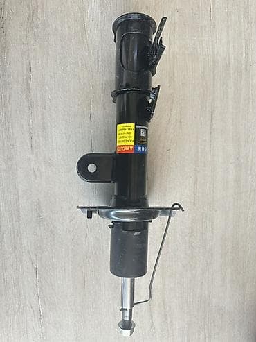 Передний амортизатор