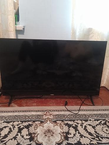 Телевизор VISION (диагональ около 43–50"). - Тонкие рамки, на