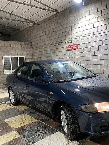 люки крыши: Mazda 323: 1997 г., 1.5 л, Автомат, Бензин, Седан — 1