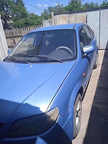 мтз 1021: Mazda 323: 2002 г., 1.6 л, Механика, Бензин, Хэтчбэк — 4