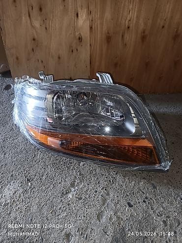 Передняя левая фара Chevrolet 2006 г., Новый