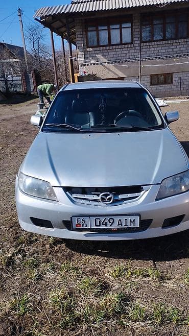 Mazda 323: 2002 г., 1.3 л, Механика, Бензин, Универсал