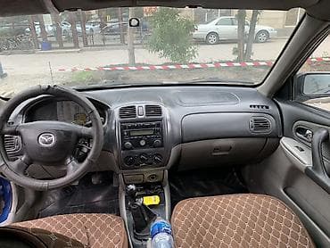 Продажа авто: Mazda Familia: 2001 г., 1.6 л, Механика, Бензин, Универсал — 6