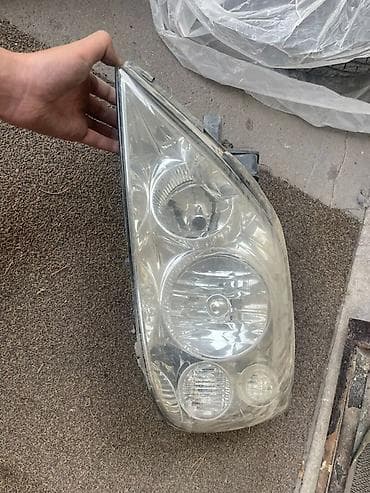 Автокосметика: Передняя левая фара Nissan 2003 г., Б/у, Оригинал — 1