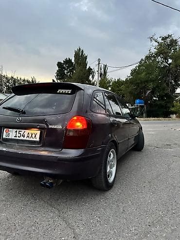 in car: Mazda 323: 1999 г., Бензин, Хэтчбэк — 2