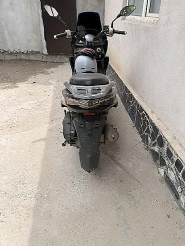 aion v plus: Скутер Wuben (50–125 cc класс) в чёрном цвете. Реальным клиентам — 5