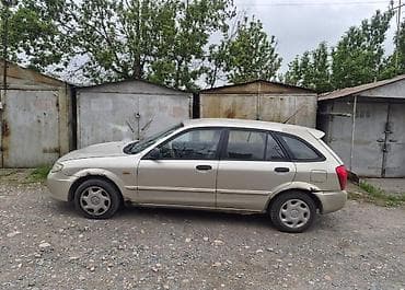 lada 2105: Mazda Familia: 2002 г., 1.3 л, Механика, Бензин, Универсал — 4