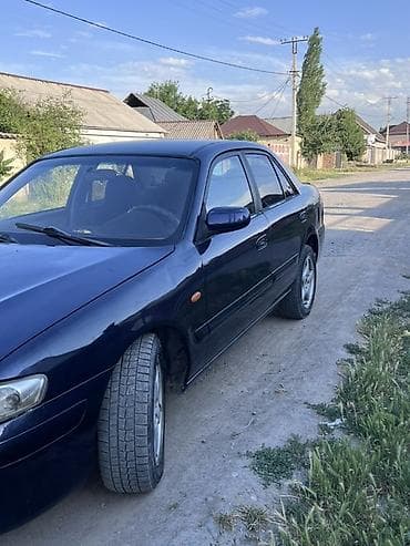 стоп gx: Mazda 626: 2000 г., 2 л, Механика, Бензин, Седан — 3