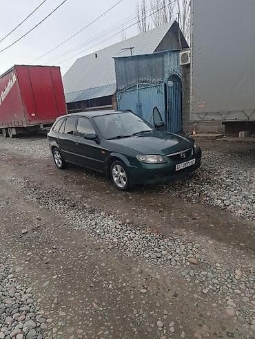 mini copper: Mazda 323: 2002 г., 1.6 л, Механика, Универсал — 6