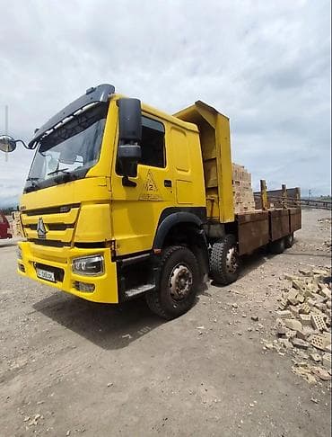 Унаа: Самосвал Howo (CNHTC) 371, желтый. - Колесная формула 6x4. - Мощность — 8