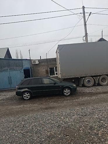 mini copper: Mazda 323: 2002 г., 1.6 л, Механика, Универсал — 3