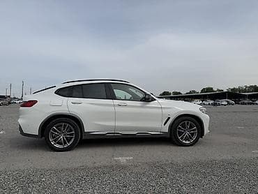 x 7: BMW X4 — интерьер и оснащение - Спортивный кожаный руль M с — 4