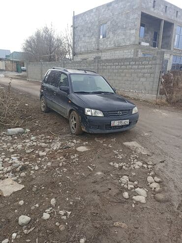 урулган машиналар: Mazda Demio: 2002 г., 1.3 л, Механика, Бензин, Хэтчбэк — 7