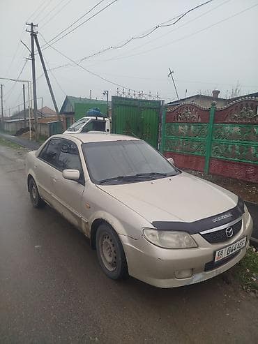 Транспорт: Mazda 323: 2001 г., 1.6 л, Кол менен иштөөчү, Бензин, Седан — 2