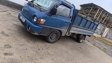 Унаа: Hyundai Porter — малотоннажный бортовой грузовик синего цвета — 3