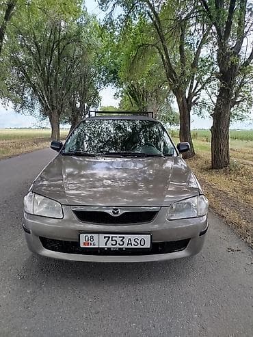 step wgn: Mazda 323: 1999 г., 1.6 л, Механика, Бензин, Универсал — 1