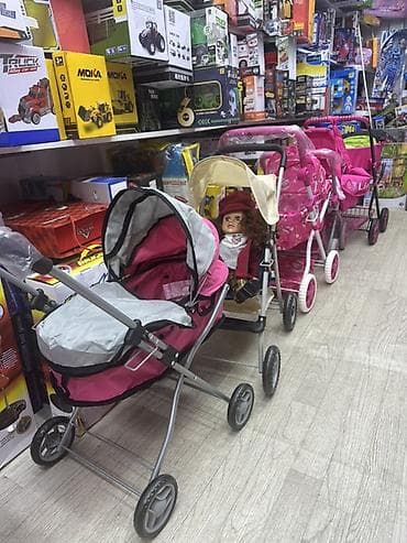 Игровые коляски для кукол - Разновидности: люльки и прогулочные